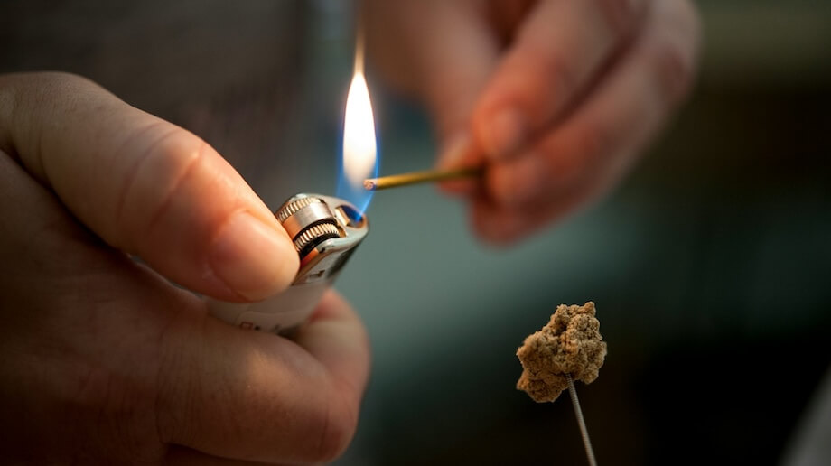 Lighting Moxa on a Needle - Moxibustion